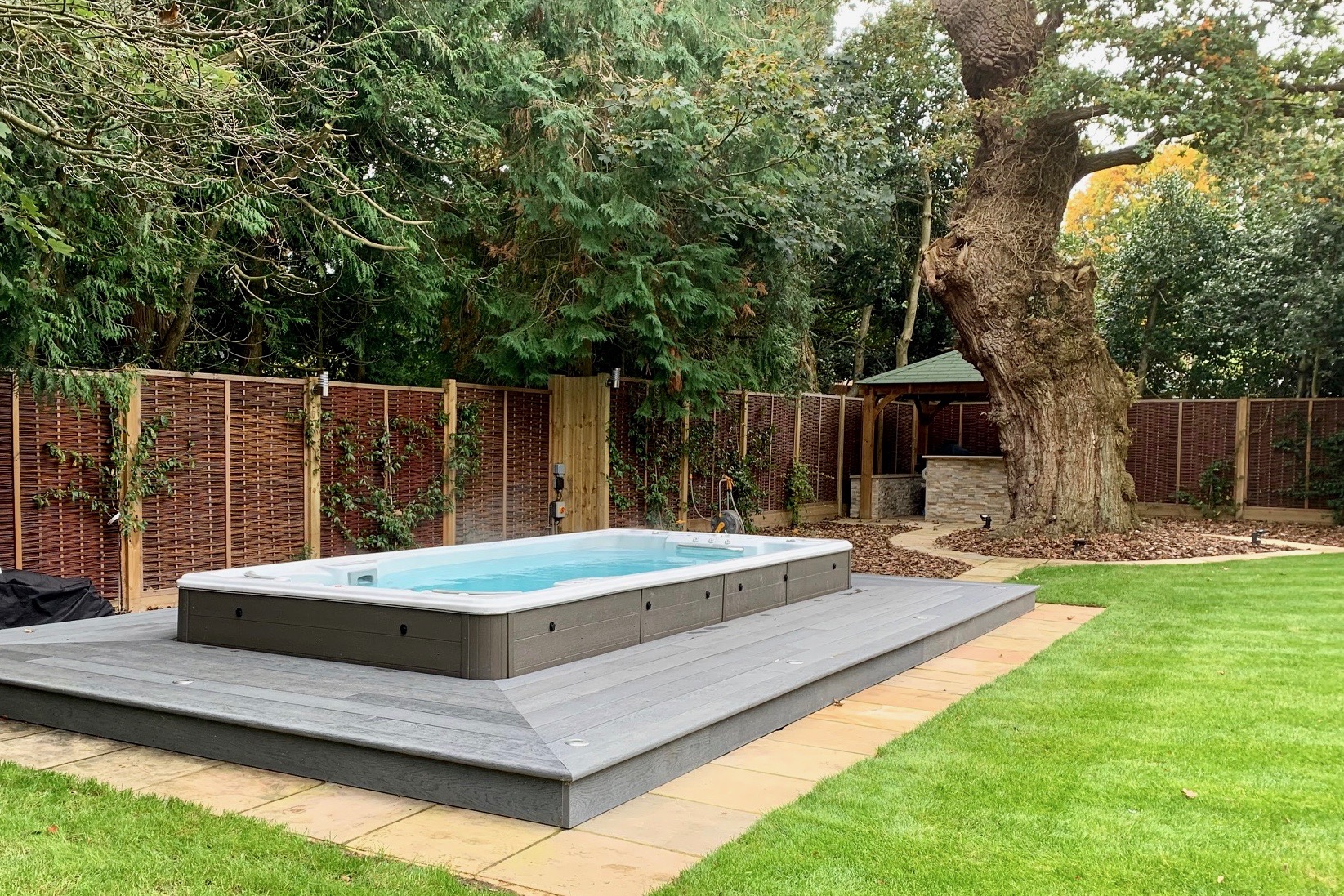 Swimspa Hydrolife Swim spa in garden with decking
